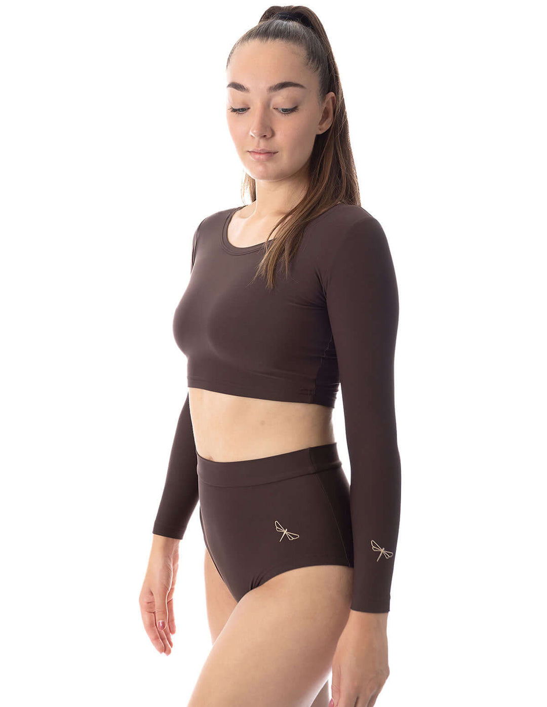 Scrunch pole shorts Lola model showcasing high-waisted pole dancing shorts and long sleeve top in brown.