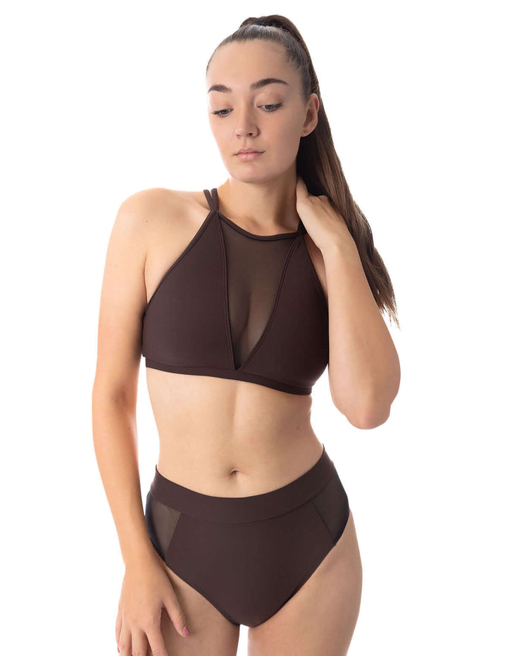 Mesh pole shorts Molly model wearing a stylish brown bikini with a mesh design, ideal for beach or poolside.